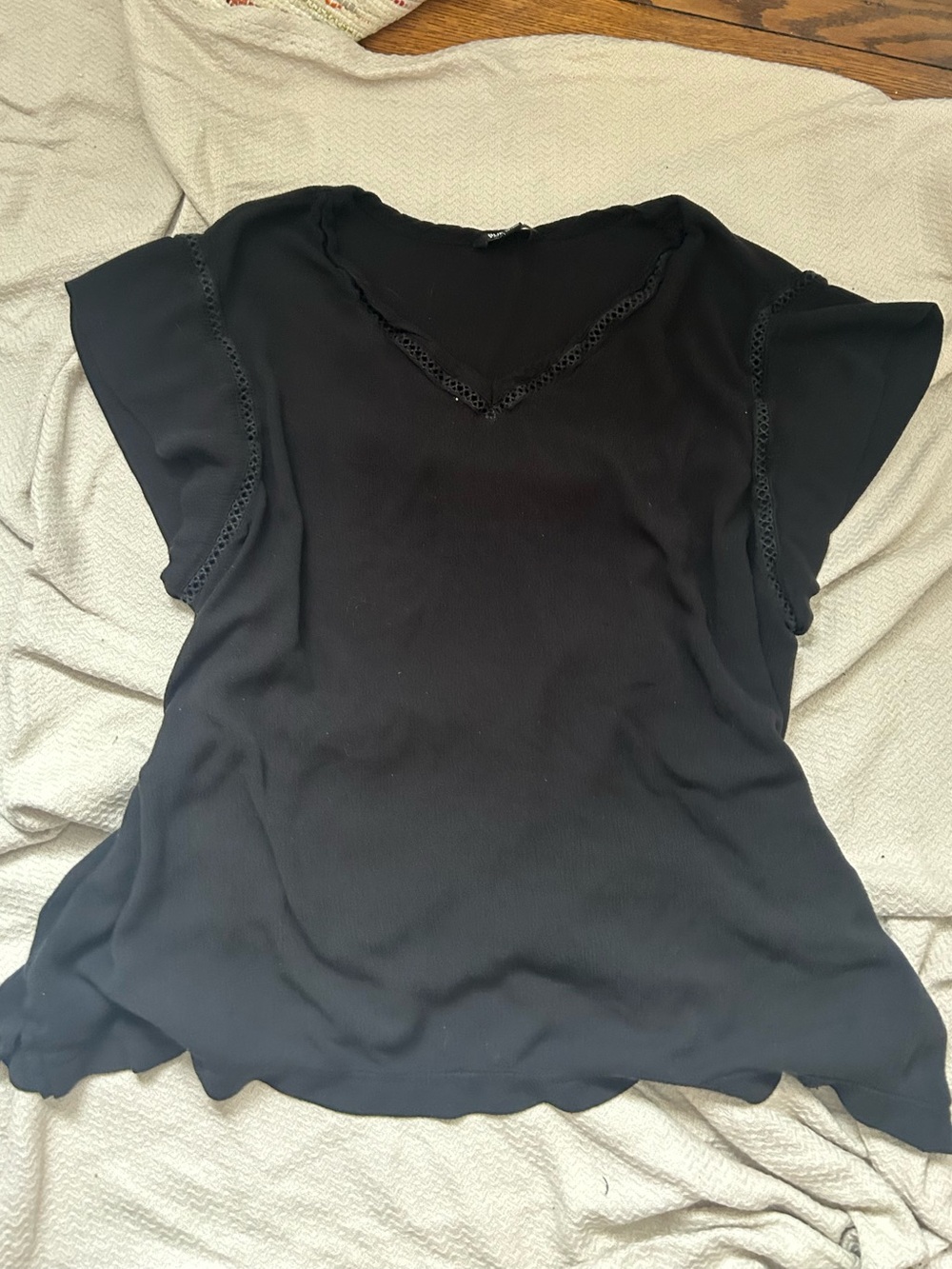V-neck blouse with crochet trimming